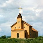 Scenic rural church against cloudy sky