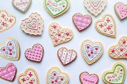 Assorted Valentines Day heart-shaped cookies decorated with icing.