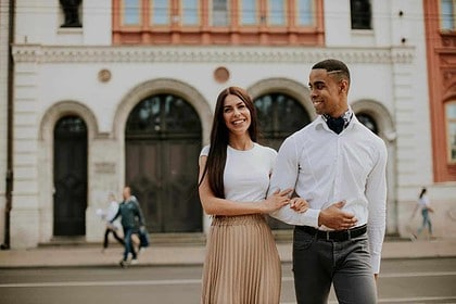 Multiethnic couple enjoying a walk in the city.