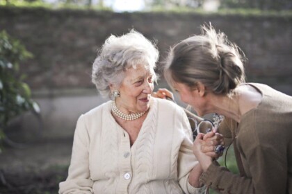 Two women sharing a joyful conversation.
