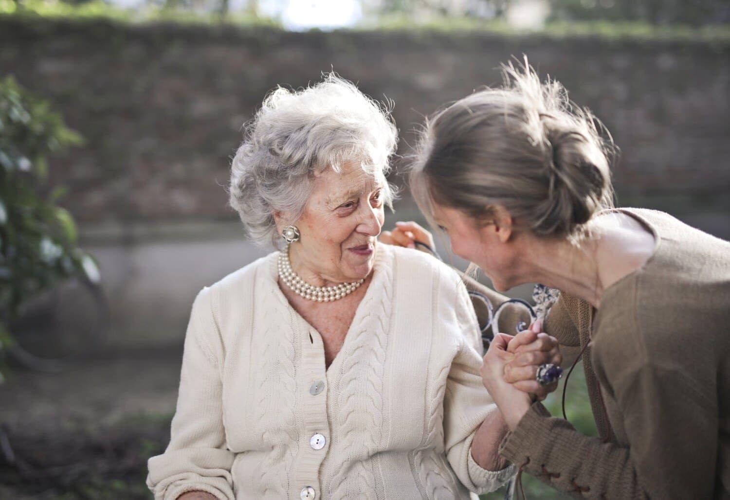 Two women sharing a joyful conversation.