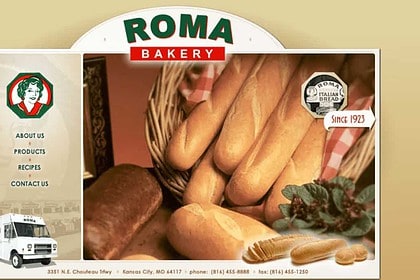 Assorted artisan bread selection at Roma Bakery display.