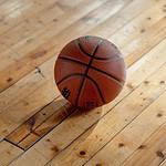 Basketball on polished wooden floor