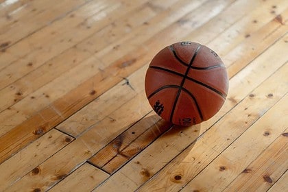 Basketball on polished wooden floor