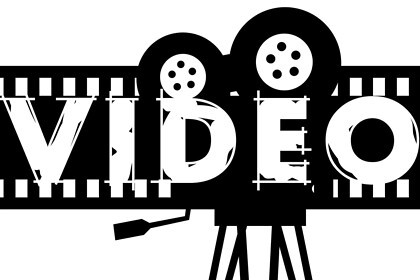 Classic cinema projector and film with VIDEO text illustration.