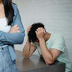 Person comforting another during a mental health crisis.