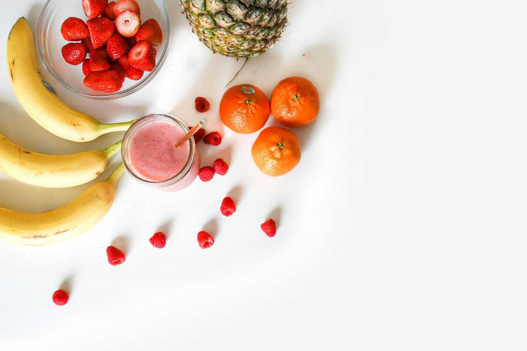 a bunch of fruits and smoothie
